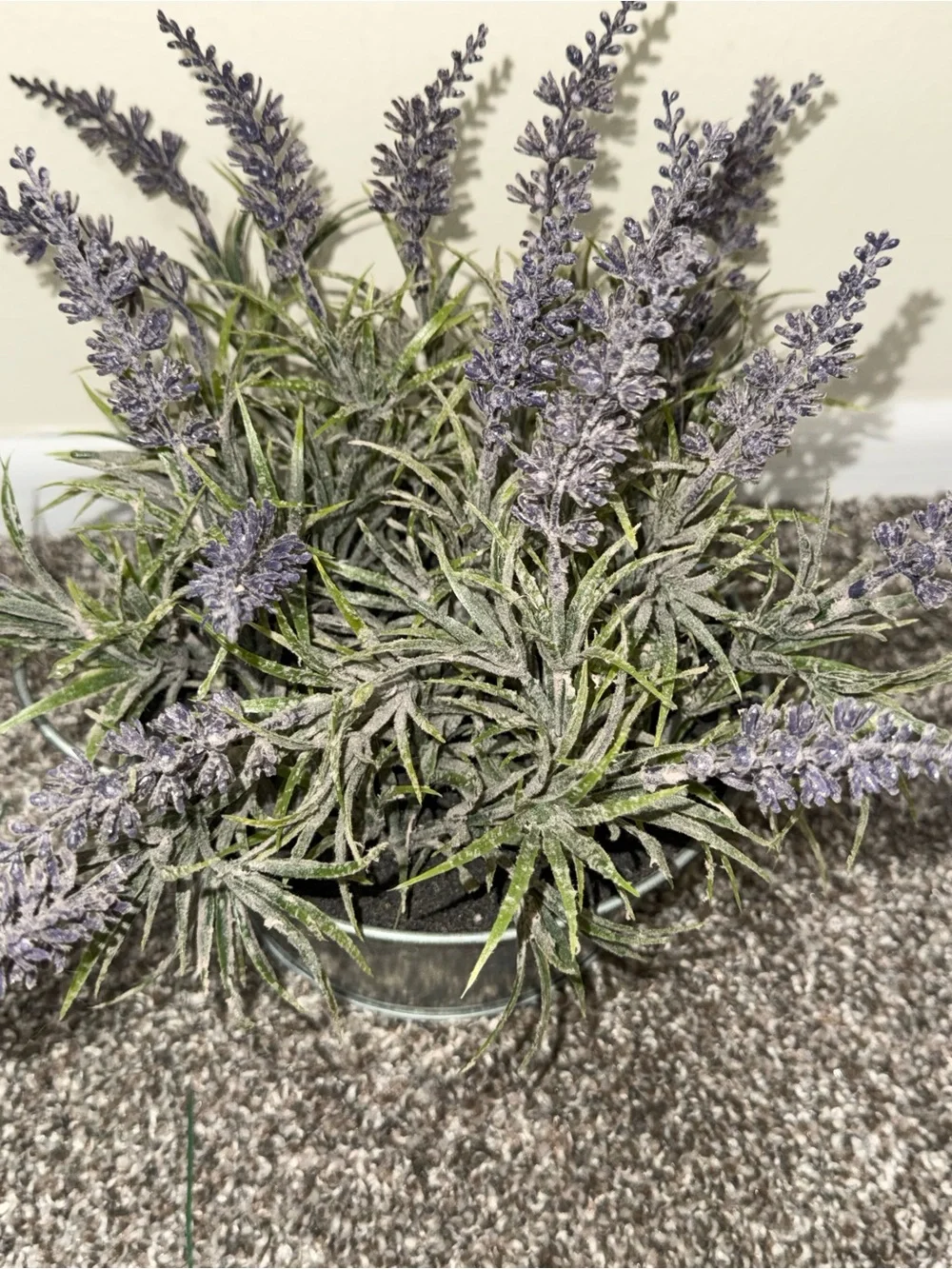 Artificial lavender plant in silver bucket